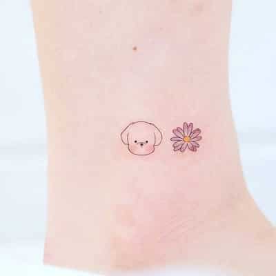 Đảm bảo đáng yêu với mẫu hình xăm cún ở chân kết hợp nhẹ nhàng với hình hoa nhỏ