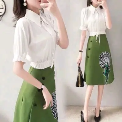 Set áo trắng rút eo chân váy in hoa – giá sỉ 195,000 – 215,000đ /bộ.